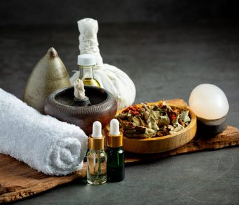 herbal-compress-herbal-spa-treatment-equipments-put-dark-floor-min