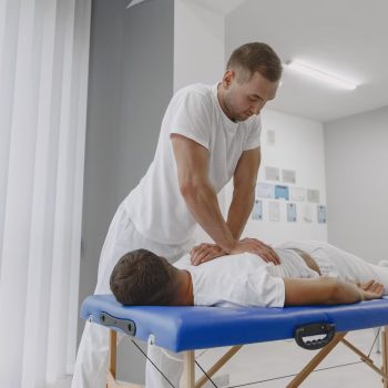 man-medical-office-physiotherapist-is-rehabilitating-back_1157-43679 man-medical-office-physiotherapist-is-rehabilitating-back_1157-43679