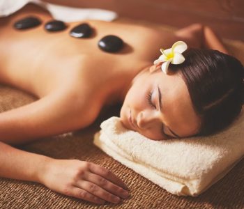 woman-enjoying-stone-massage_1098-3182